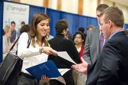 A student talks to a recruiter at the Statler College Career Fair